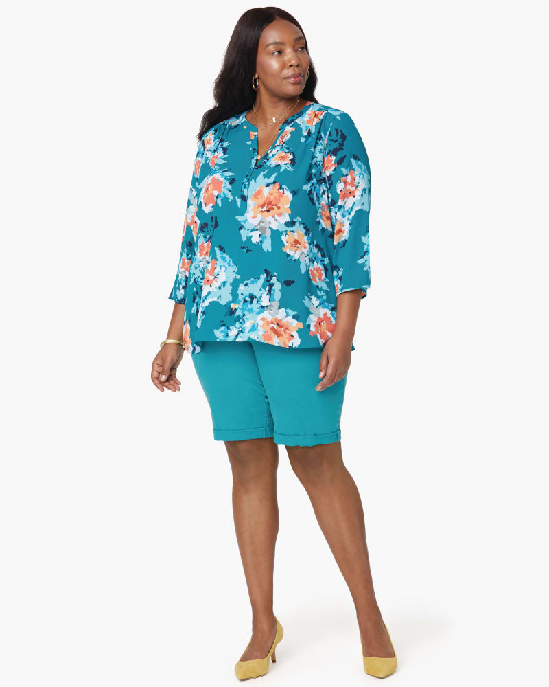 Front of a model wearing a size 1X Perfect Blouse in Orange Blossom by NYDJ. | dia_product_style_image_id:166388